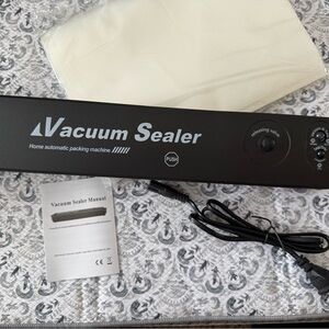 Vacuum Sealer Machine and storage bags - New in Box!